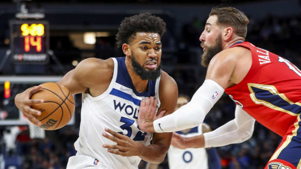 Oct 25, 2021; Minneapolis, Minnesota, USA; Minnesota Timberwolves center Karl-Anthony Towns (32) drives around New Orleans Pelicans center Jonas Valanciunas (17) in the first quarter at Target Center. Mandatory Credit: Bruce Kluckhohn-USA TODAY Sports